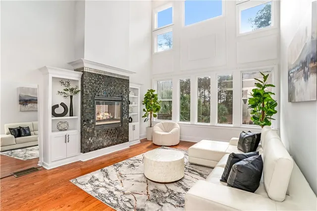 a living room with furniture and a potted plant