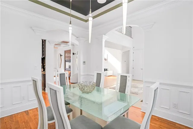 a view of a dining room with furniture and wooden floor