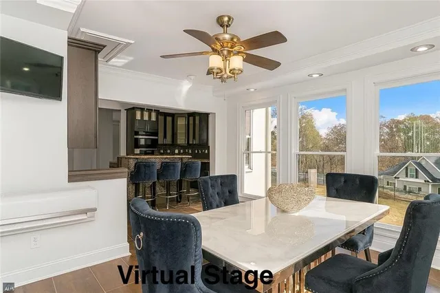 a view of a dining room with furniture window and outside view