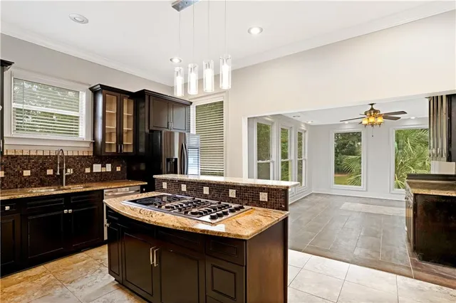 a kitchen with a stove and a sink