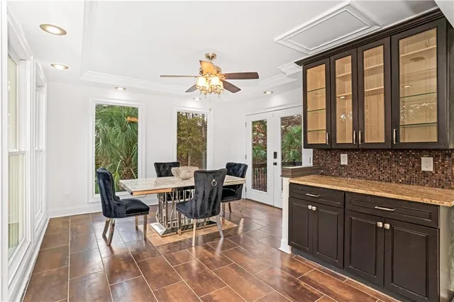a view of a dining room with furniture window and outside view