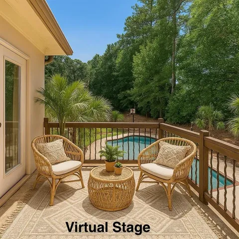 a view of a chair and table on the deck