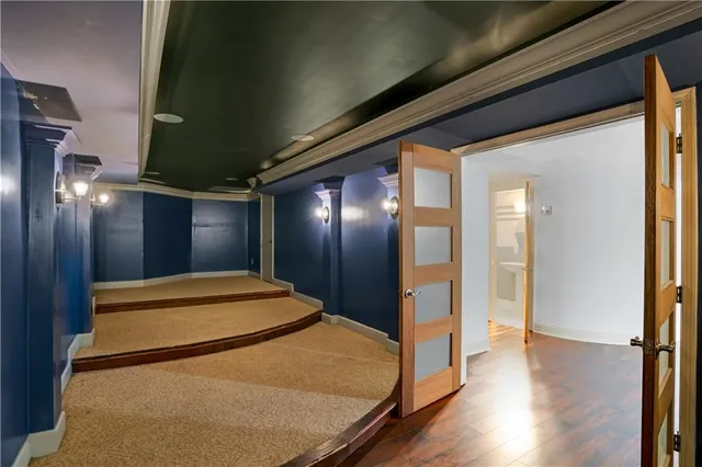 a spacious bathroom with a mirror and a shower