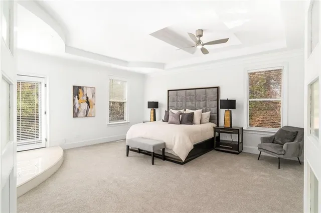 a bed room with a bed and a chair