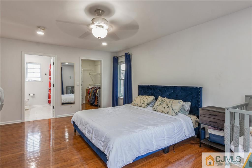 31 Hancock Road Piscataway, NJ 08854 - Photo 16 of 29 a spacious bedroom with a bed and a chandelier