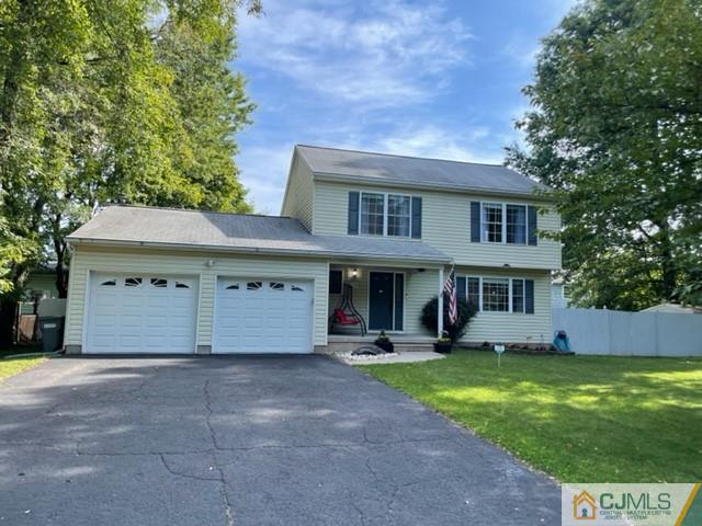 31 Hancock Road Piscataway, NJ 08854 - Photo 2 of 29 a view of a white house with large windows and a small yard