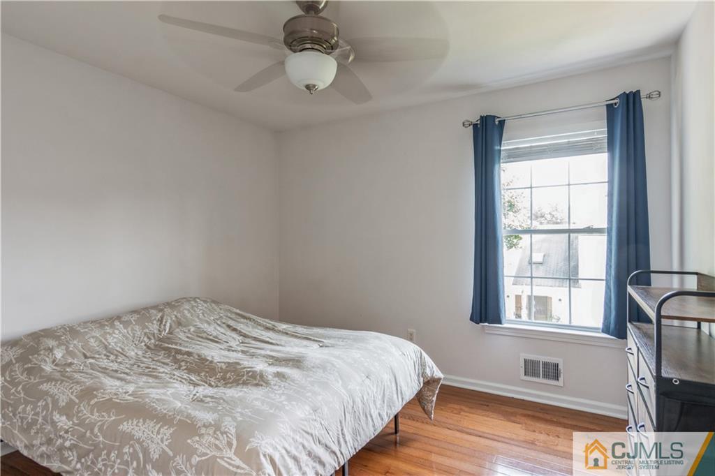 31 Hancock Road Piscataway, NJ 08854 - Photo 21 of 29 a bedroom with a bed and wooden floor