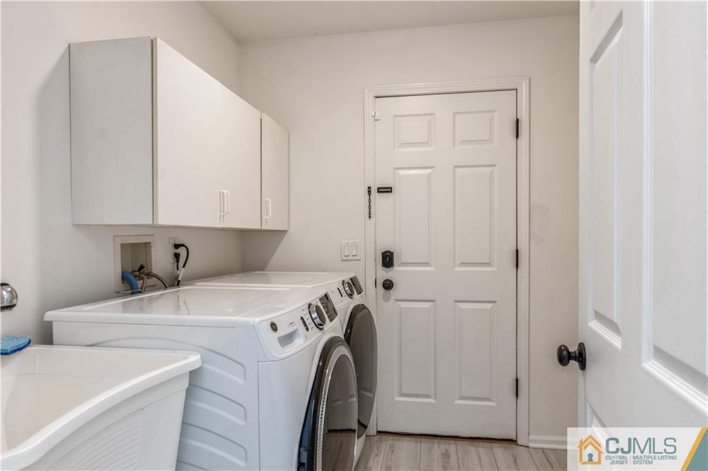 31 Hancock Road Piscataway, NJ 08854 - Photo 23 of 29 a view of a storage and utility room with washer and dryer