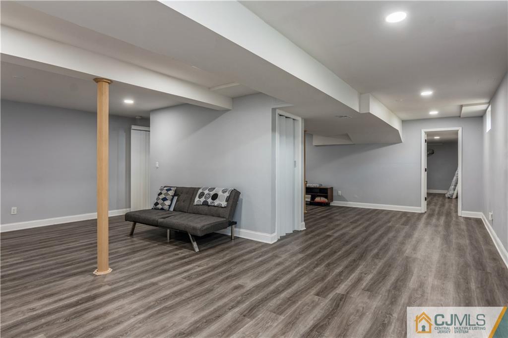 31 Hancock Road Piscataway, NJ 08854 - Photo 25 of 29 a living room with furniture and a wooden floor