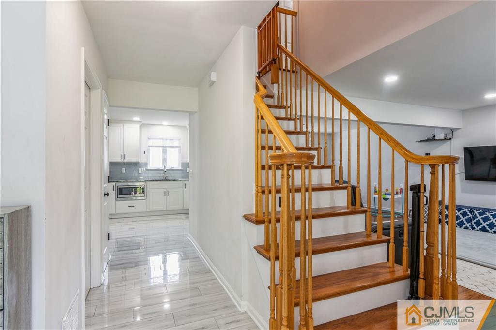 31 Hancock Road Piscataway, NJ 08854 - Photo 3 of 29 a view of staircase with wooden floor and stairs