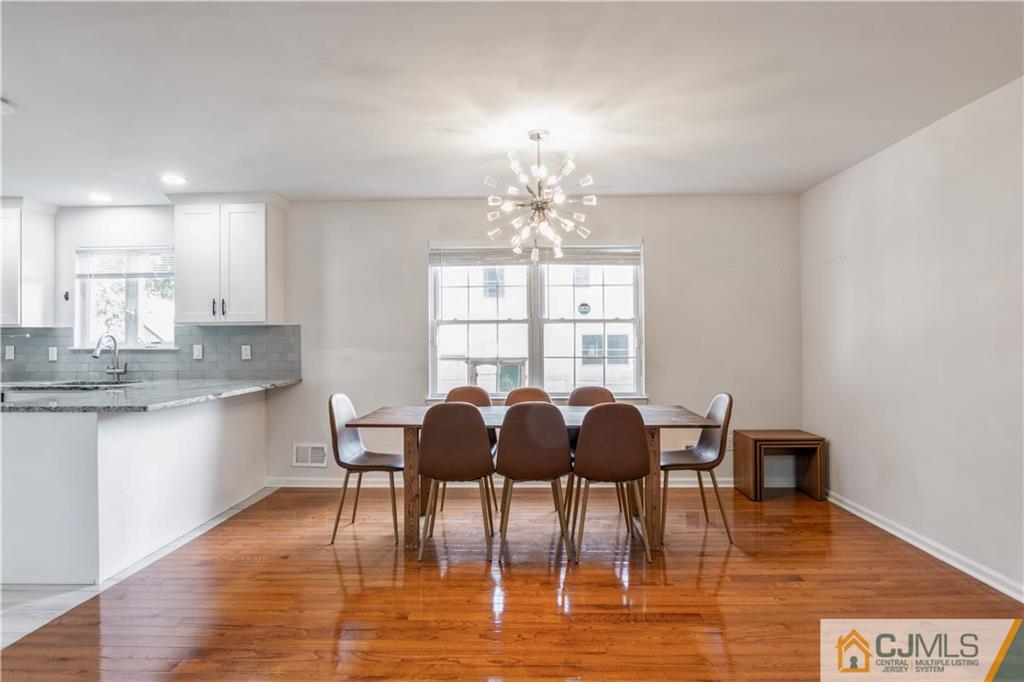 31 Hancock Road Piscataway, NJ 08854 - Photo 7 of 29 a view of a dining room with furniture and wooden floor