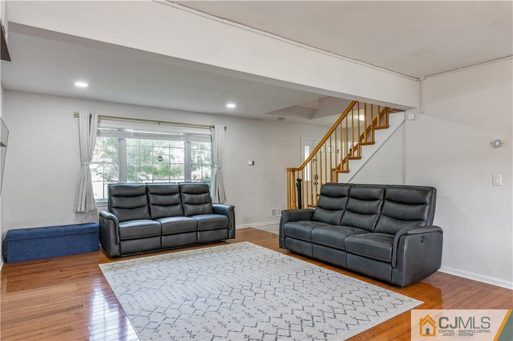 31 Hancock Road Piscataway, NJ 08854 - Photo 8 of 29 a living room with furniture and a couch
