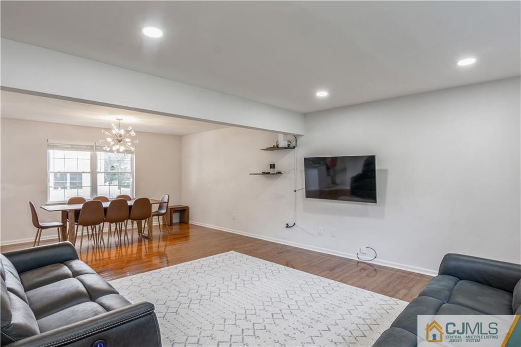 31 Hancock Road Piscataway, NJ 08854 - Photo 10 of 29 a living room with furniture and a flat screen tv