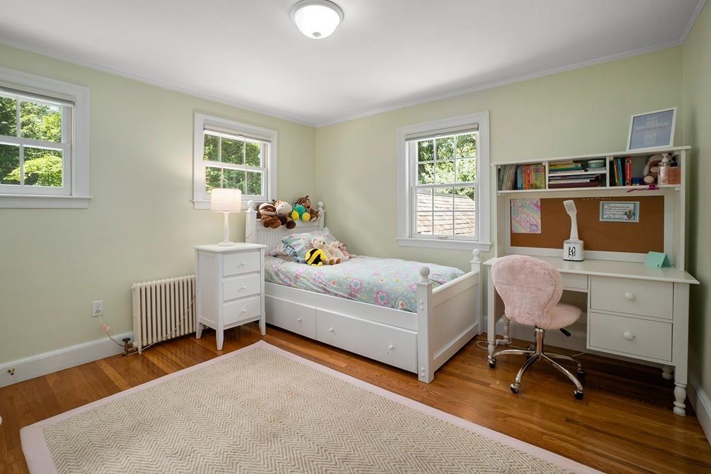 224 Rutledge Road Belmont, MA 02478 - Photo 20 of 30 a bedroom with a bed and wooden floor