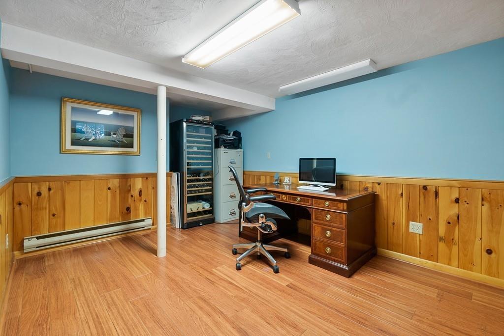 224 Rutledge Road Belmont, MA 02478 - Photo 23 of 30 a view of a workspace with furniture and wooden floor