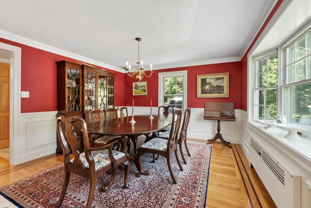 224 Rutledge Road Belmont, MA 02478 - Photo 8 of 30 a dining room with furniture a chandelier and wooden floor