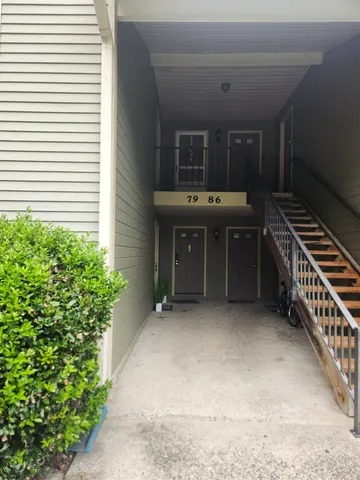 a view of a hallway with entryway door