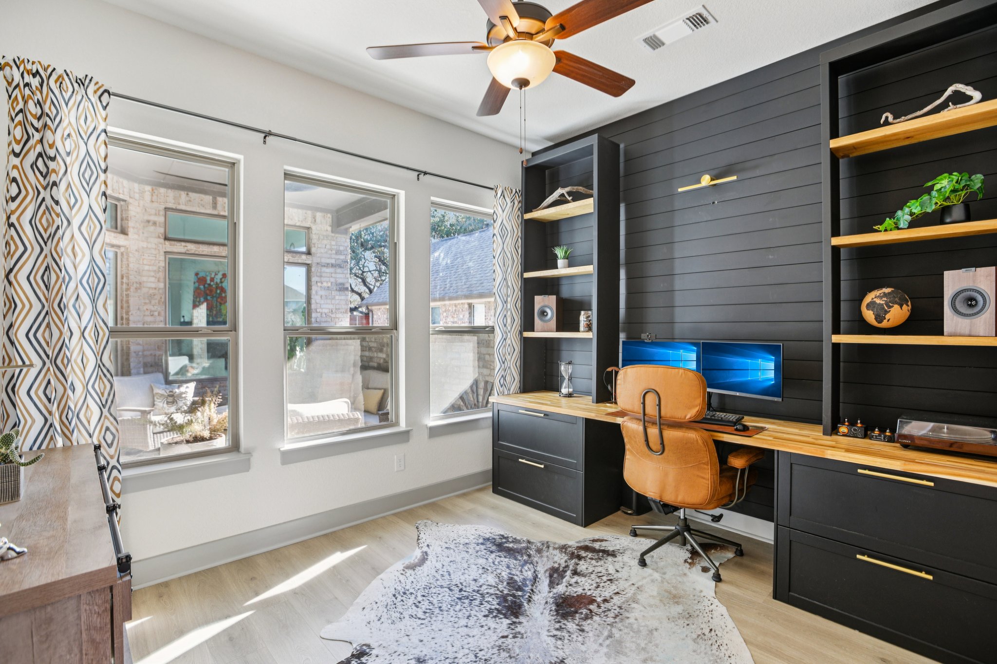 133 Lake Spring Circle Georgetown, TX 78633 - Photo 11 of 31 a view of a workspace with furniture and a window