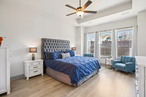 a bedroom with a bed and a couch