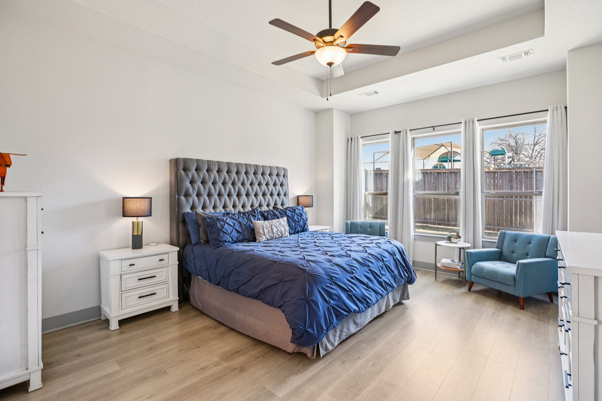 133 Lake Spring Circle Georgetown, TX 78633 - Photo 12 of 31 a bedroom with a bed and a couch