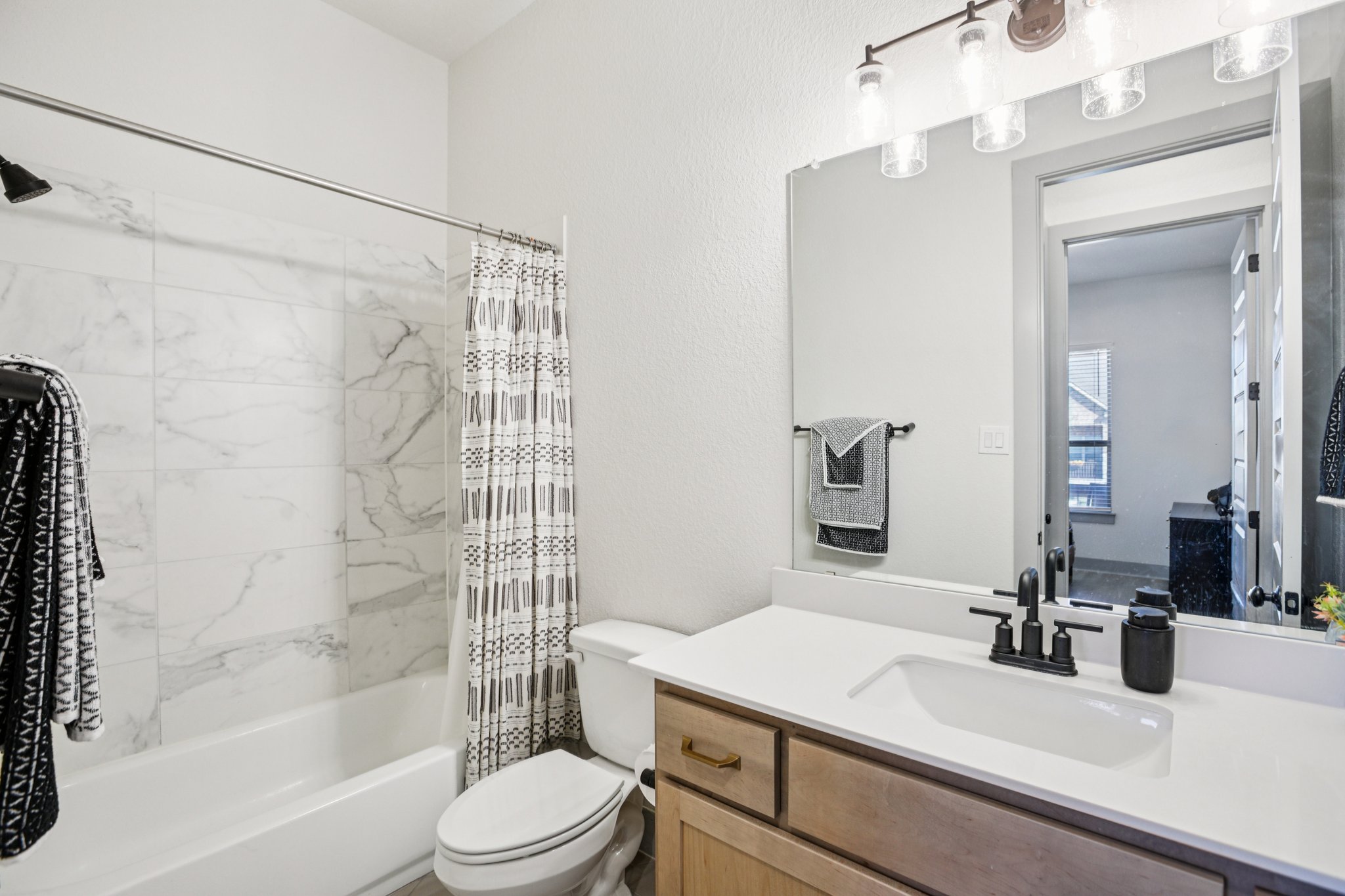133 Lake Spring Circle Georgetown, TX 78633 - Photo 17 of 31 a bathroom with a sink a toilet and shower