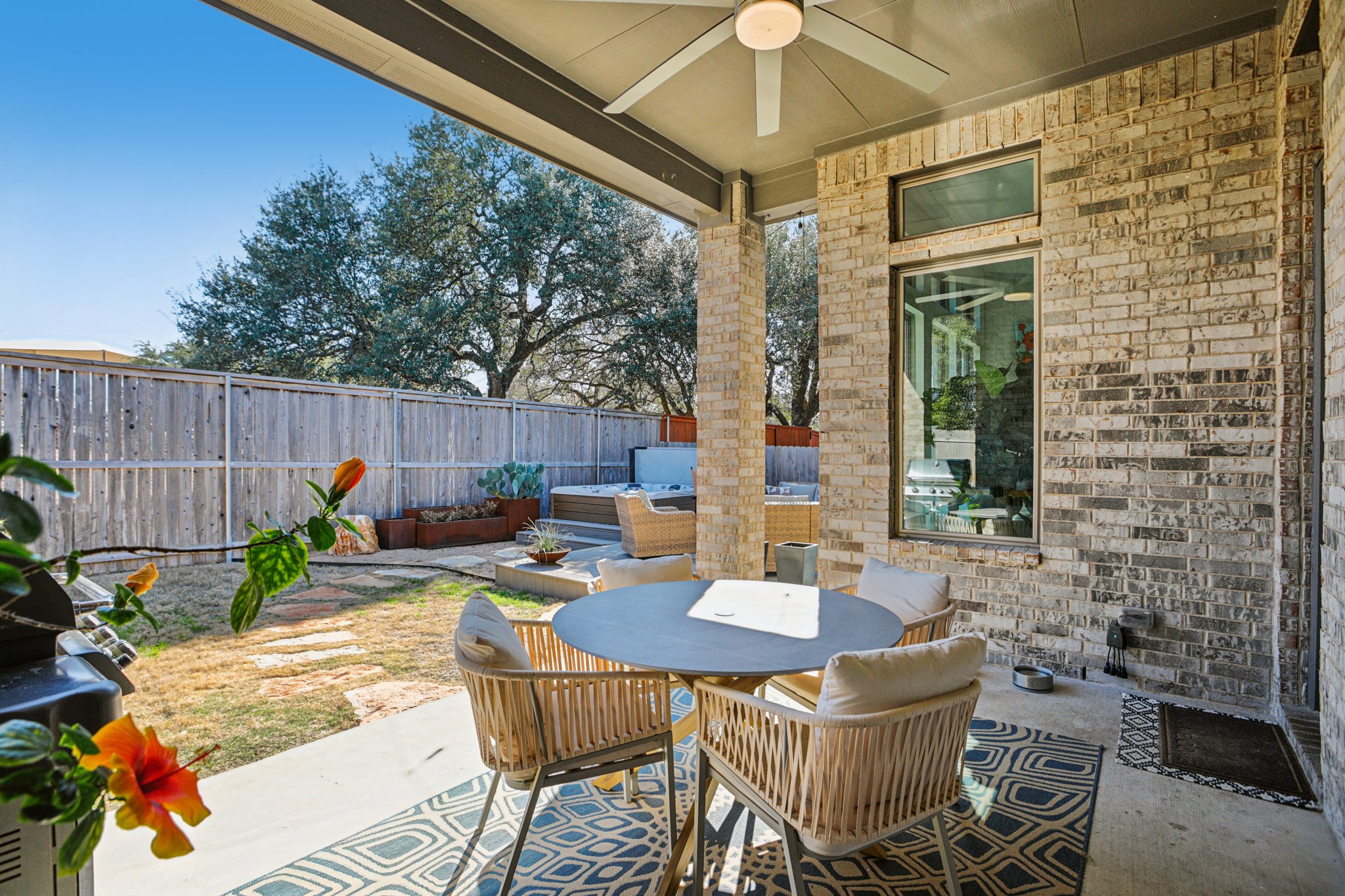 133 Lake Spring Circle Georgetown, TX 78633 - Photo 23 of 31 a view of a patio with a dining table and chairs