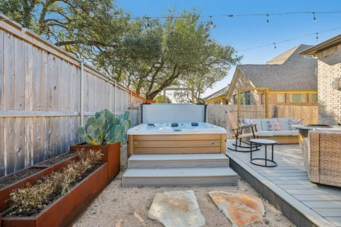 a view of house with backyard outdoor seating and barbeque oven