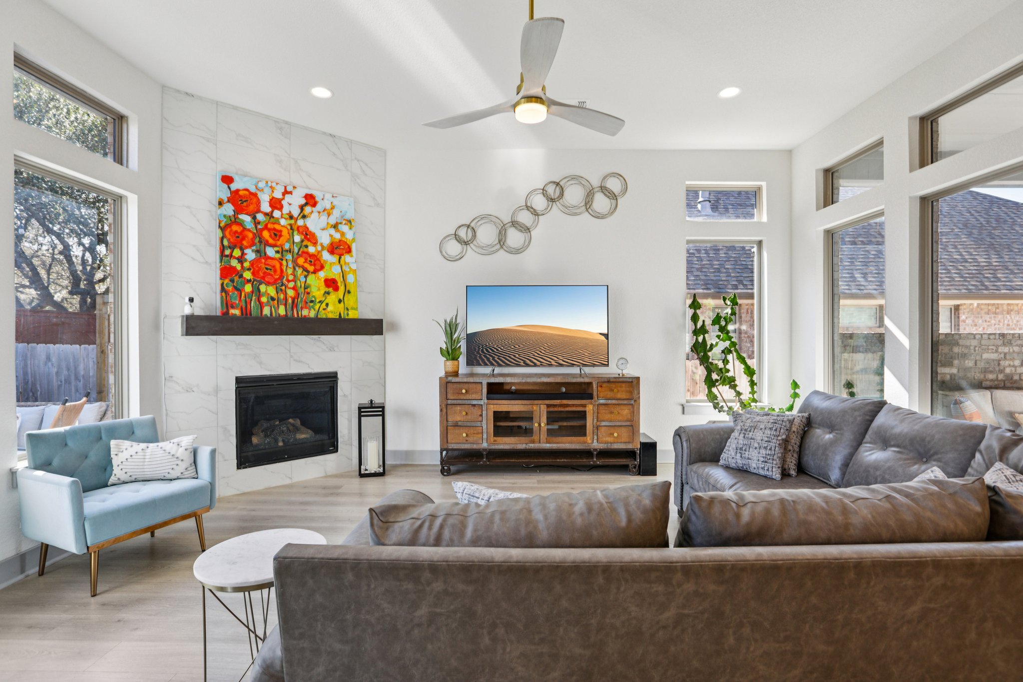 133 Lake Spring Circle Georgetown, TX 78633 - Photo 3 of 31 a living room with furniture a fireplace and a large window