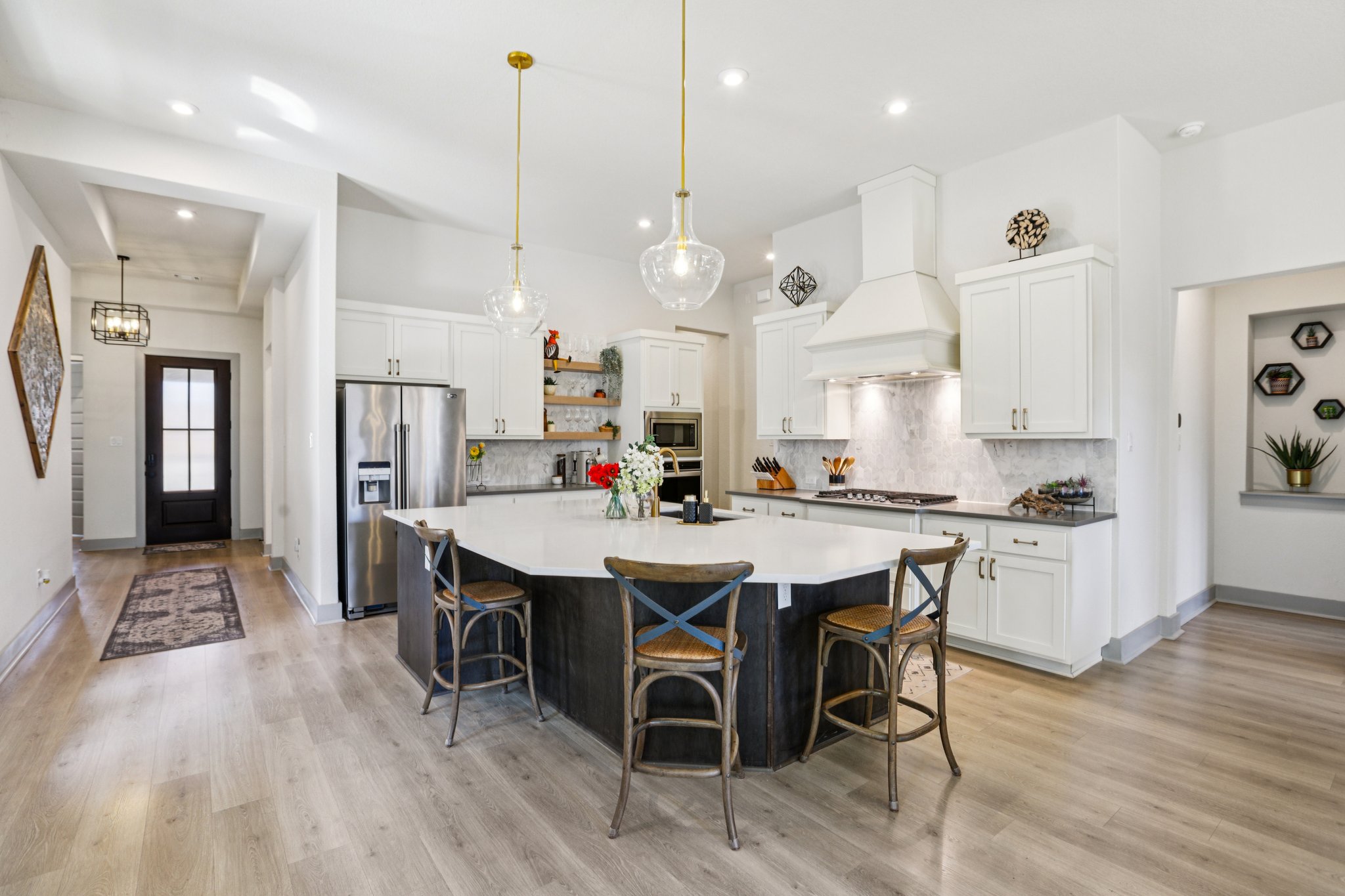 133 Lake Spring Circle Georgetown, TX 78633 - Photo 7 of 31 a large kitchen with a table and chairs