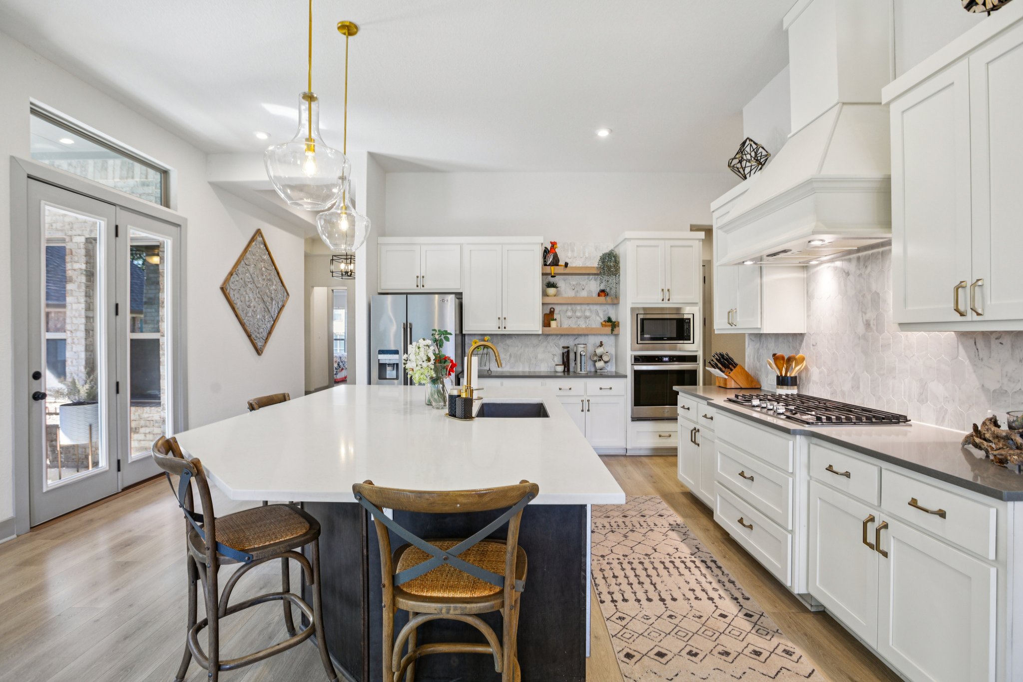 133 Lake Spring Circle Georgetown, TX 78633 - Photo 8 of 31 a large kitchen with kitchen island a large island in it