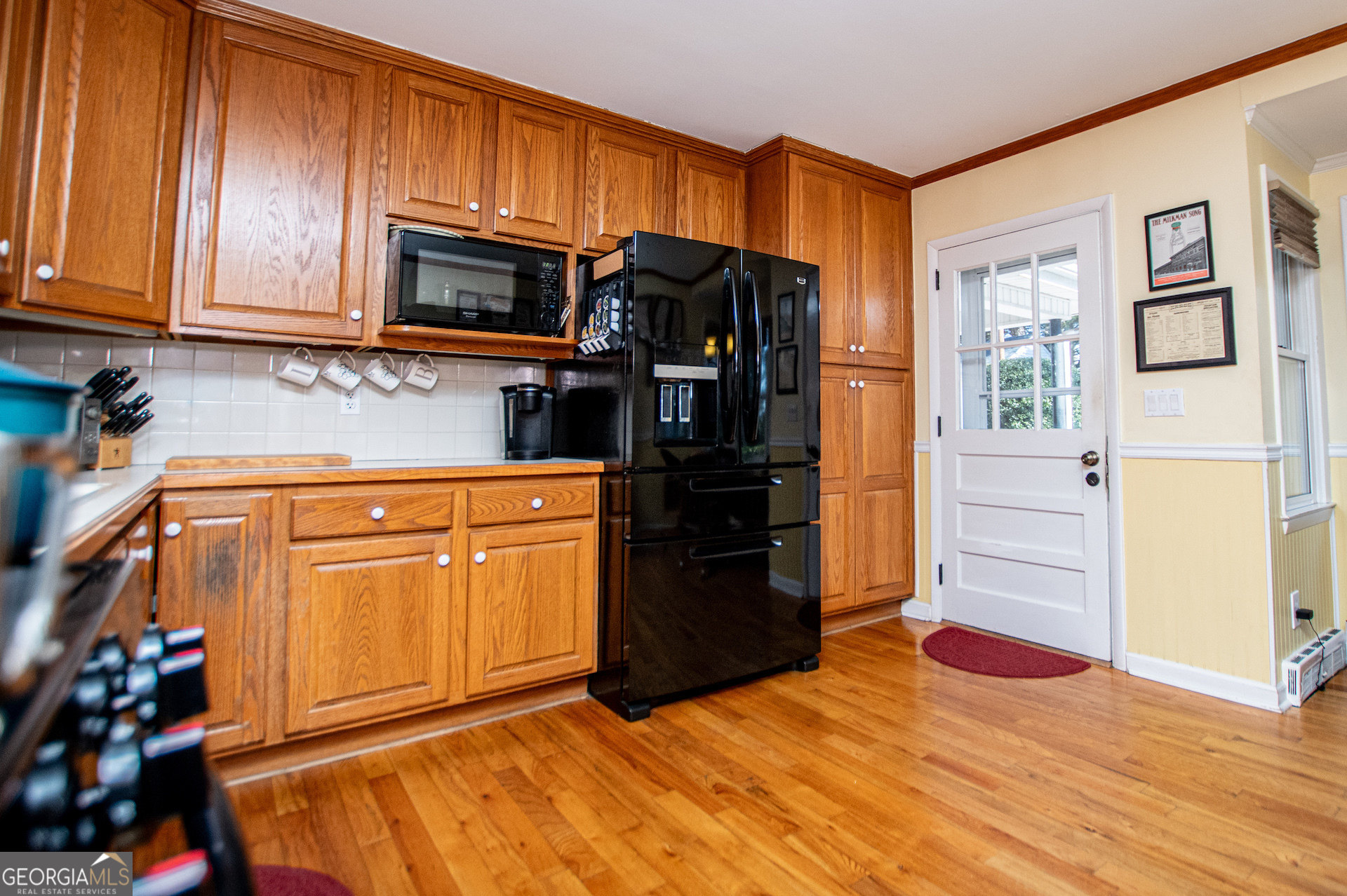 310 Kramer Street Carrollton, GA 30117 - Photo 20 of 99 a kitchen with stainless steel appliances granite countertop a refrigerator stove and cabinets