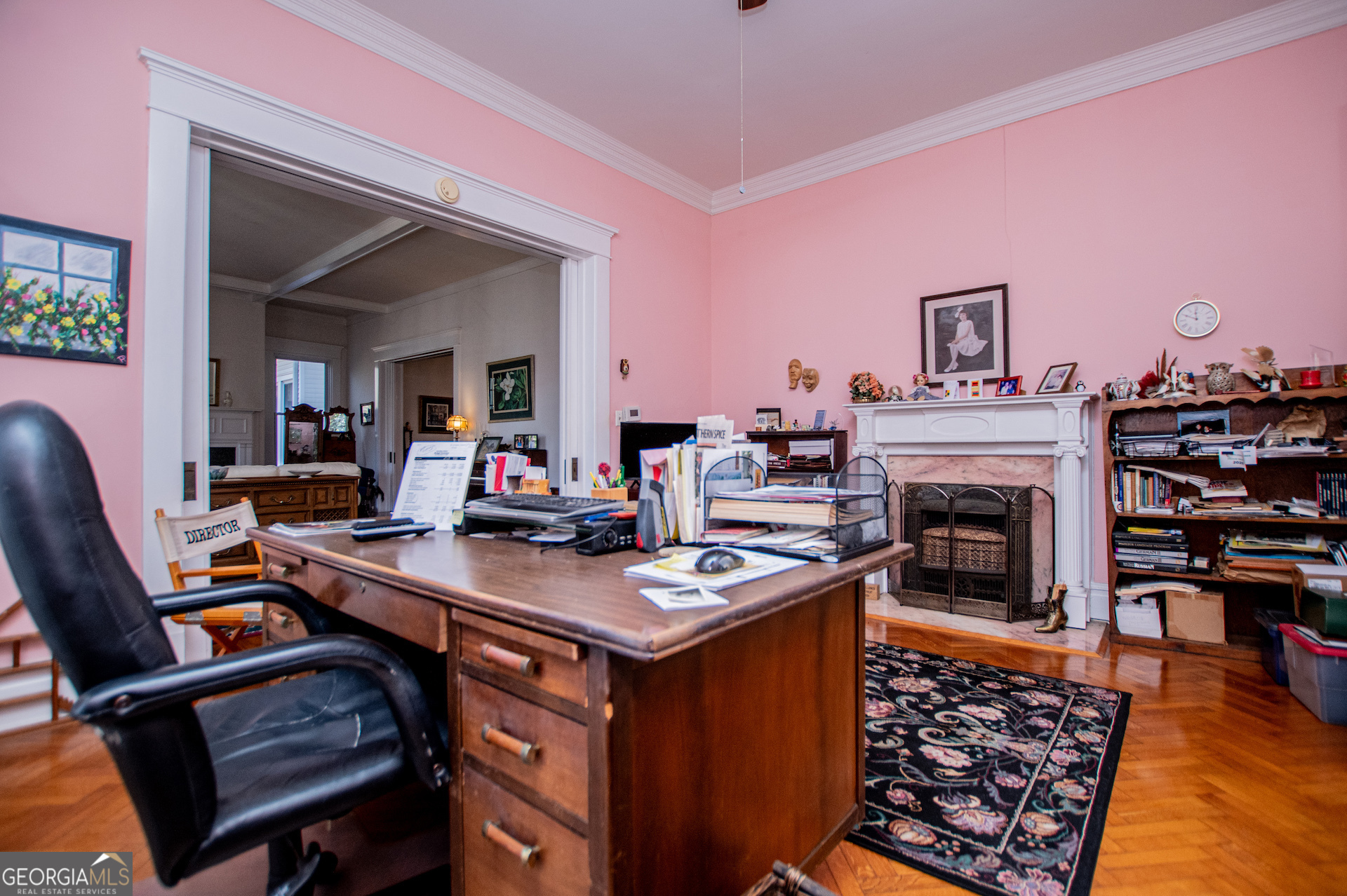 310 Kramer Street Carrollton, GA 30117 - Photo 22 of 99 a work room with furniture a fireplace and a flat screen tv