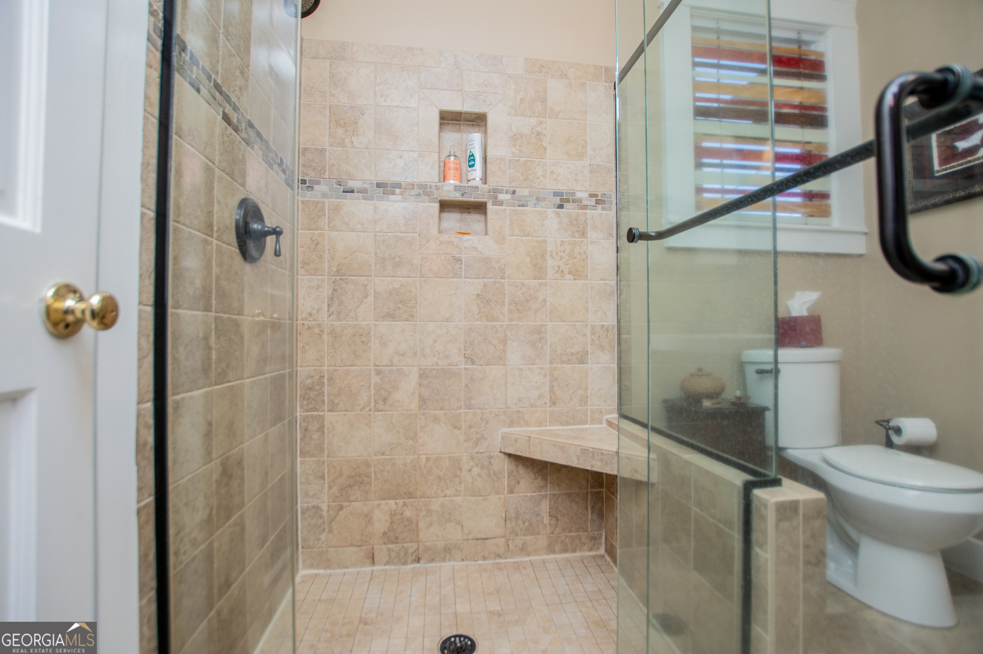 310 Kramer Street Carrollton, GA 30117 - Photo 32 of 99 a bathroom with a shower and a toilet