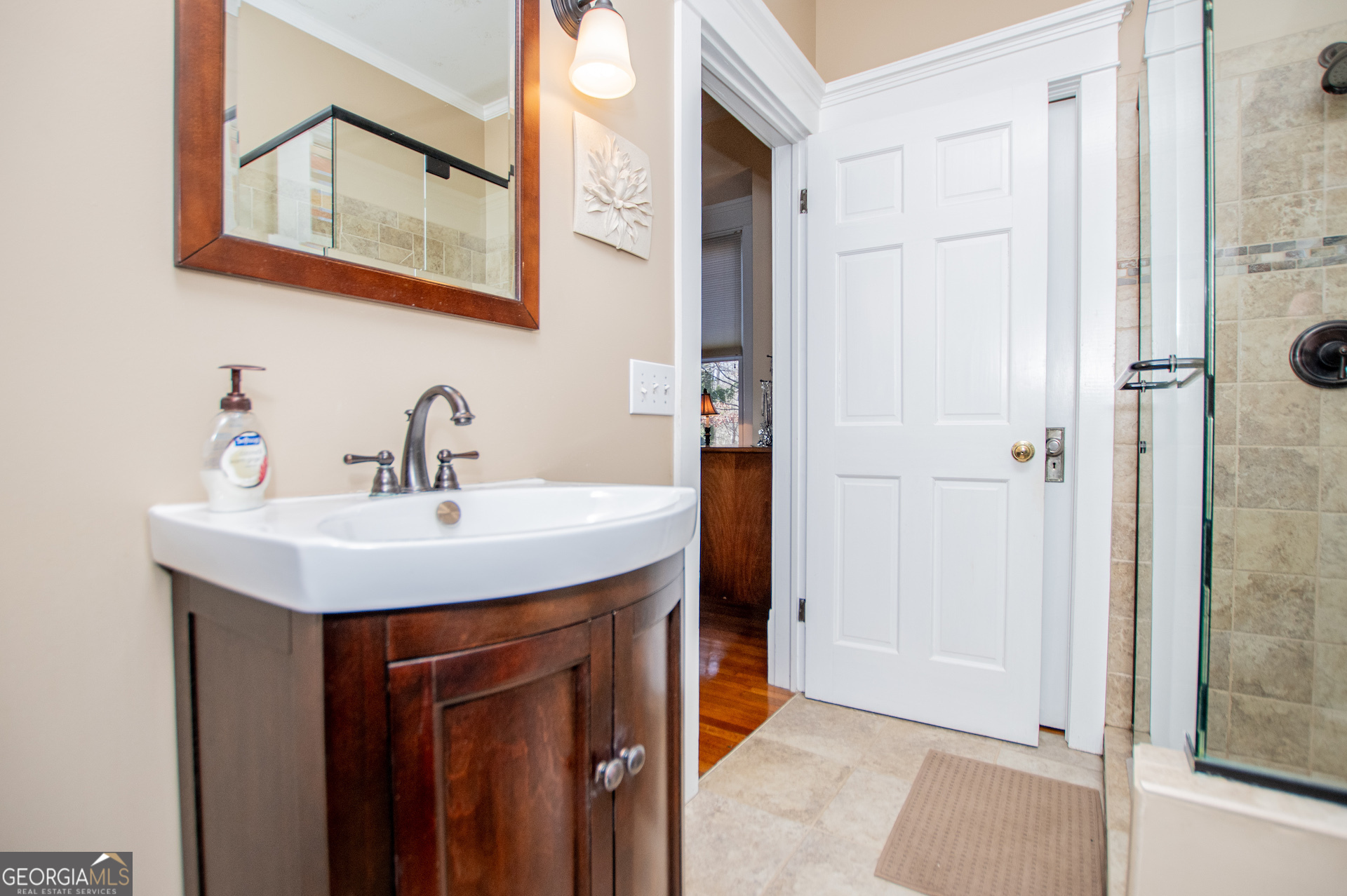 310 Kramer Street Carrollton, GA 30117 - Photo 33 of 99 a bathroom with a sink and a mirror