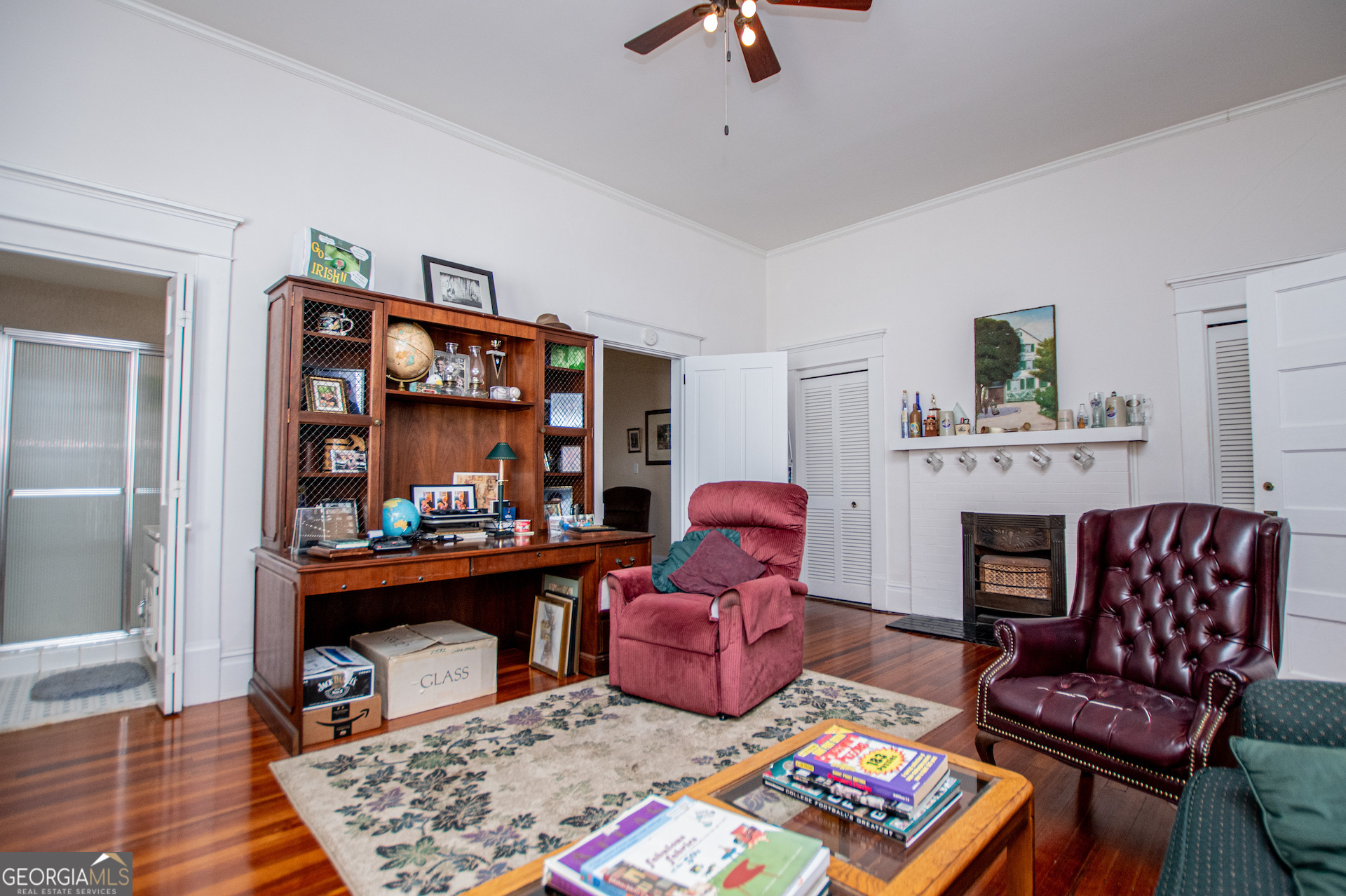 310 Kramer Street Carrollton, GA 30117 - Photo 47 of 99 a living room with furniture and a fireplace