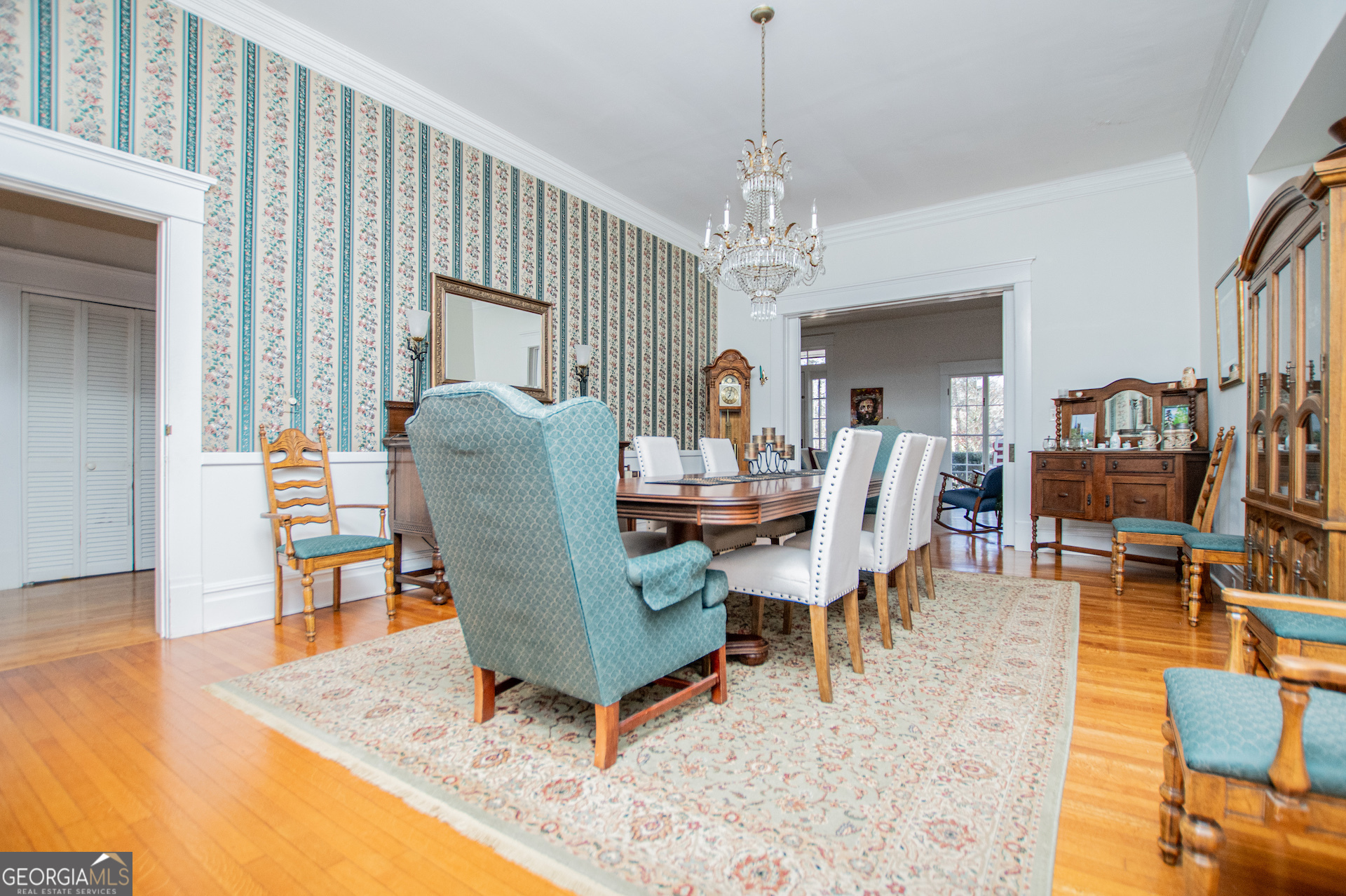 310 Kramer Street Carrollton, GA 30117 - Photo 10 of 99 a living room with furniture a chandelier and a dining table
