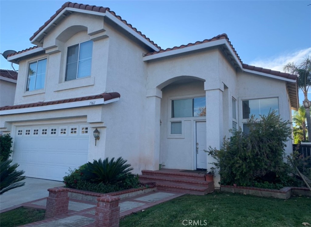 7361 Barnstable Place Riverside, CA 92506 - Photo 1 of 1 a view of a house with a yard plants and large tree