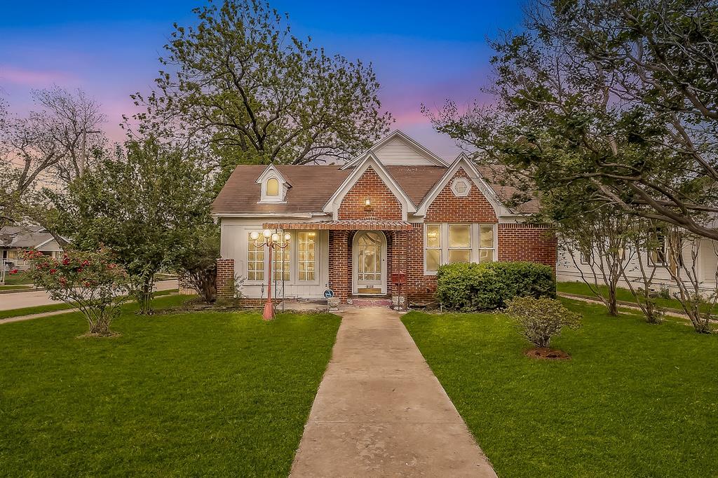 1500 Proctor Avenue Waco, TX 76708 - Photo 1 of 40 The property features an architectural style with brick facade accents, a front gable roof, and a dormer window