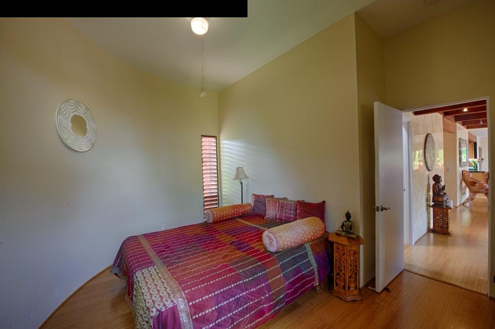 107 West Kuiaha Road Haiku, HI 96708 - Photo 15 of 20 a bedroom with a bed and a window