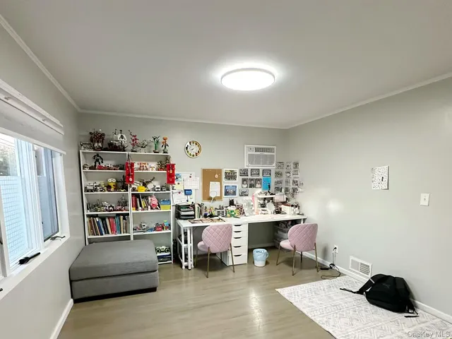 a workspace with furniture and a book shelf