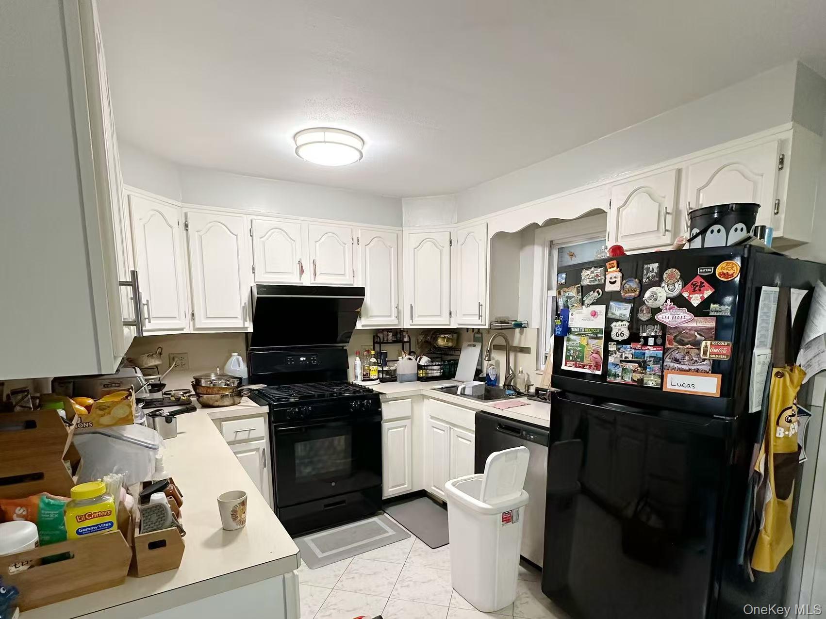 69 Virginia Avenue Plainview, NY 11803 - Photo 7 of 9 a kitchen with a sink appliances and cabinets