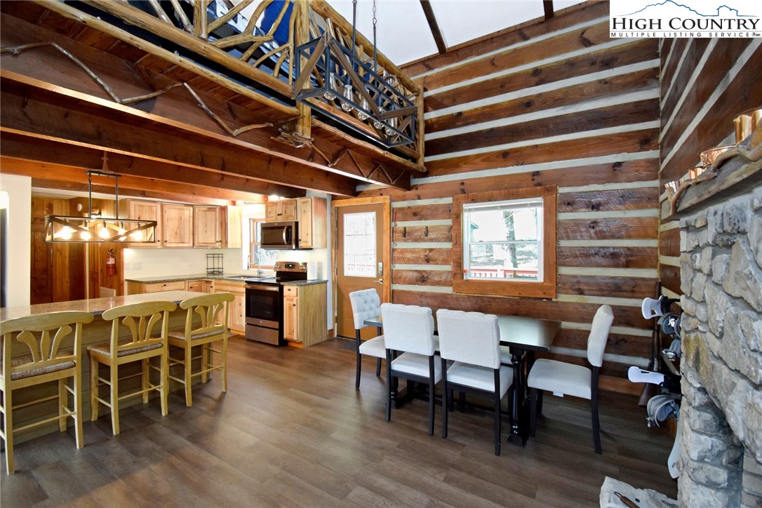 269 Willow Mountain Drive Vilas, NC 28692 - Photo 11 of 37 a dining room with furniture and wooden floor