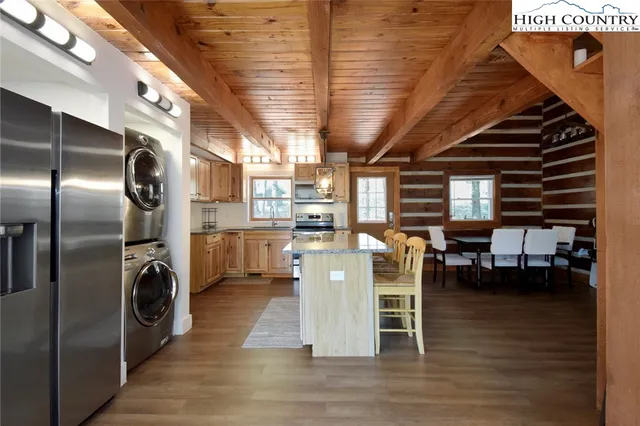 a kitchen with a stove microwave and sink