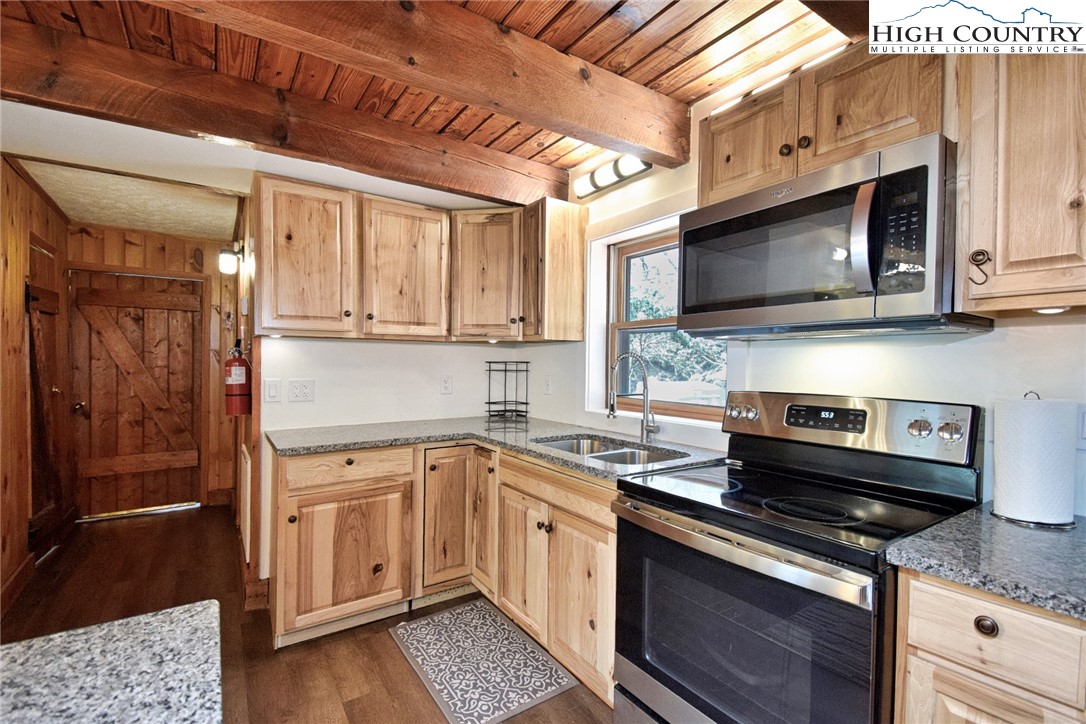269 Willow Mountain Drive Vilas, NC 28692 - Photo 15 of 37 a kitchen with a stove microwave and sink