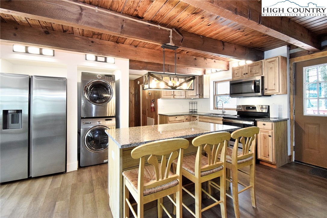 269 Willow Mountain Drive Vilas, NC 28692 - Photo 16 of 37 a kitchen with stainless steel appliances granite countertop a refrigerator and a stove top oven