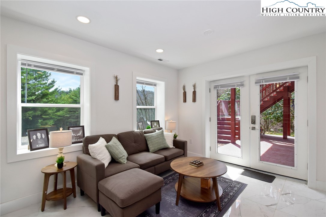 269 Willow Mountain Drive Vilas, NC 28692 - Photo 20 of 37 a living room with furniture and a large window