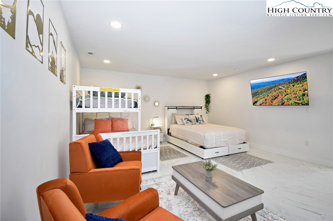269 Willow Mountain Drive Vilas, NC 28692 - Photo 25 of 37 a living room with furniture and a book shelf