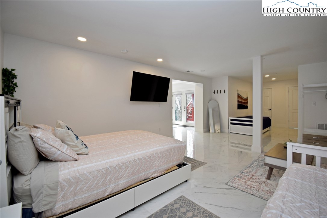 269 Willow Mountain Drive Vilas, NC 28692 - Photo 27 of 37 a bedroom with a bed and a television