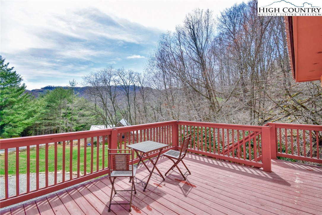 269 Willow Mountain Drive Vilas, NC 28692 - Photo 3 of 37 a view of a wooden deck with furniture