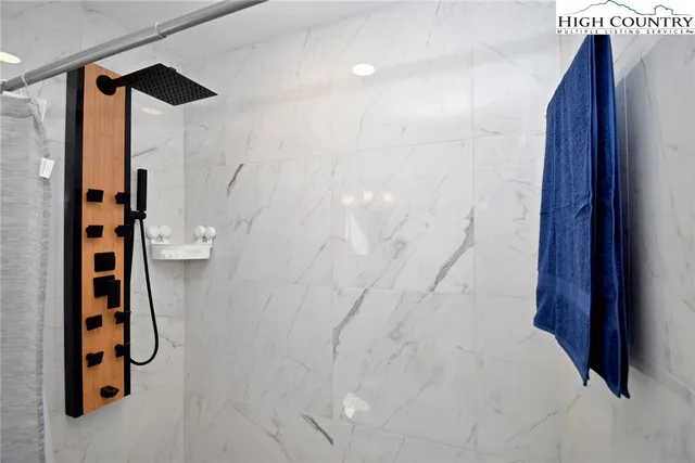 a room with furniture and view of living room